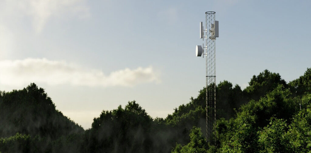 A cell phone tower with trees in the background.